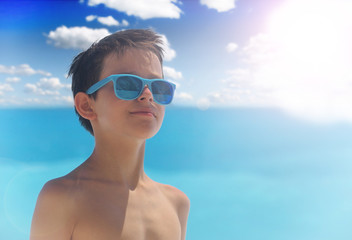 Portrait of young boy wearing sunglasses