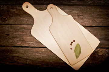 Wooden kitchen tools and utensils on rustic background