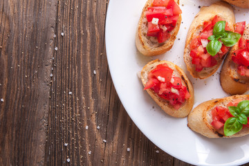 Bruschetta with tomato, onion and basil