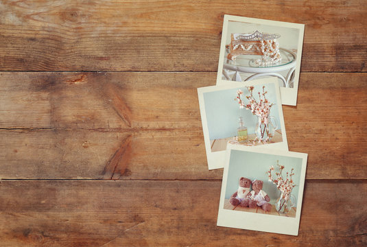 instant polaroid photos album on wooden background