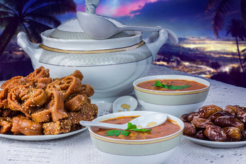 Bowl of Moroccan harira soup,chebakia, dates for iftar