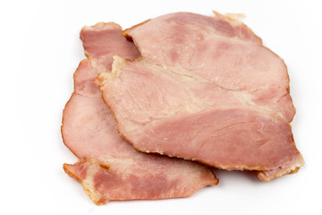 Sliced cooked smoked ham over white
