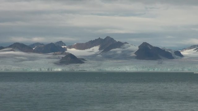 Snowy mountains and the sea in Arctic. Iceland. Fantastic wonderful amazing video grenland nature iceland. Lovely shooting the life of nature, seaside and mountains.