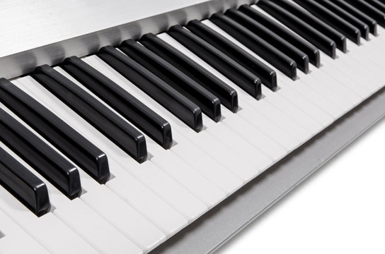 modern electric piano keys in metallic casing on white background