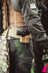 men in military uniform with weapon