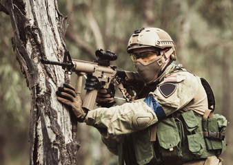 Fototapeta premium men in military uniform with weapon