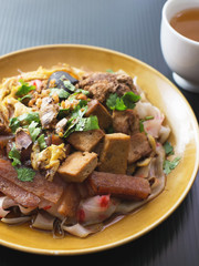 china noodle mixed with egg, sausage, pork, mushroom and tofu