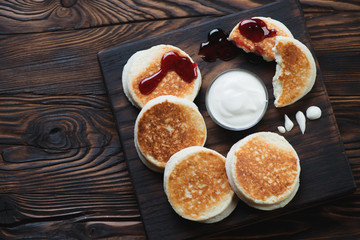Above view of curd fritters in a rustic wooden setting