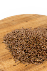 Flax seeds on the wooden board