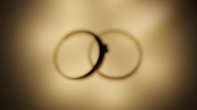 Wedding rings on the light panel stock footage