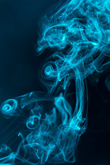 blue smoke on a black background