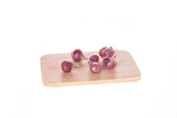 Shallot - Asia red onion on chopping board white background
