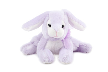 purple stuffed toy rabbit lying on the floor