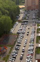 Top view of the city, courtyards, and a large number of parked cars.Russia.