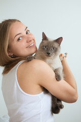 beautiful young woman with a cat

