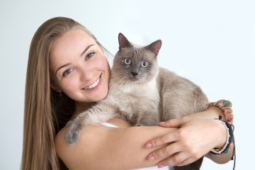 beautiful young woman with a cat

