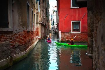 Tuinposter Venice, Italy - 19 September 2015: View of tourists rowing kayaks © Alexey Usachev
