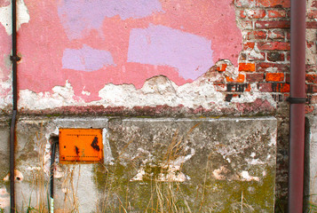 Wall of an old house in warm colours.