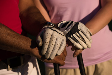 portrait of couple on golf course