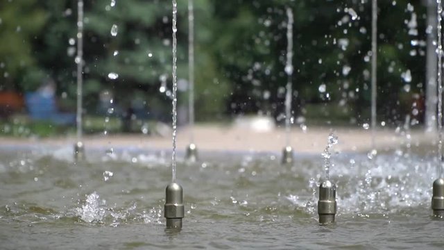 Spray a small fountain. Slow motion. Video slowed fourfold