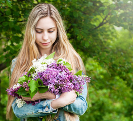 Girl with a bouquet of lilacs