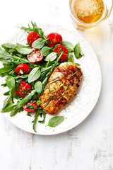 Cherry tomato and arugula salad with spring onion
