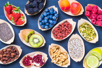 Fototapeta na wymiar Berries, fruits, nuts, seeds top view.Healthy, detox, super food concept.