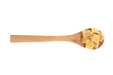 Dried pineapples cubes in wooden spoon isolated on white background