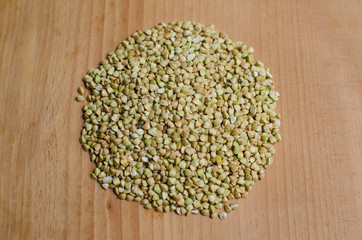 Tasty and healthy buckwheat on wooden board