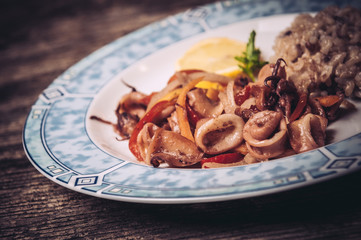 Delicious calamari rings with rice