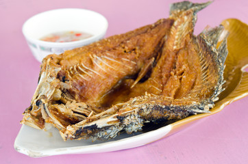 Fried striped bass fish with fish and oyster sauce