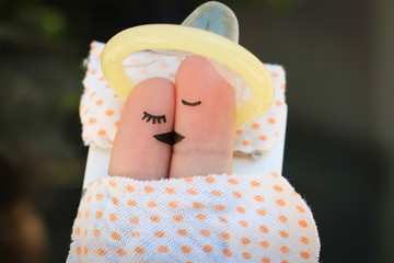 Finger art of Happy couple. Happy couple kissing and hugging. Concept of safe sex. 