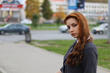 Naklejka na ściany i meble red-haired girl in autumn jacket