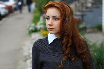 red-haired girl in autumn jacket