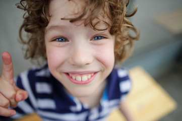 Snub-nosed boy smiling fun