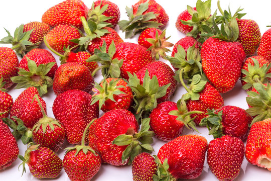 Ripe strawberries on white