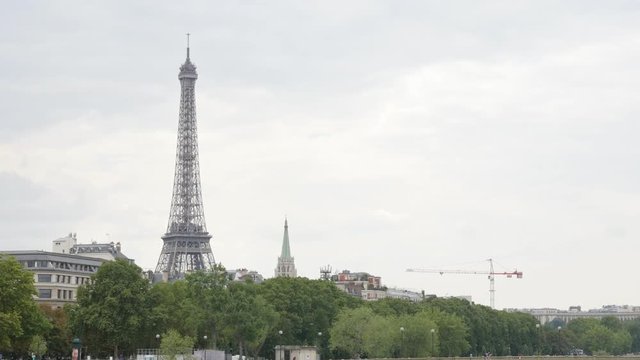 Bridges on Seine and Eiffel tower in the background slow tilting 4K 2160p 30fps UltraHD video - Bridges and river in French capital of Paris and Eiffel tower 4K 3840X2160 UHD footage 