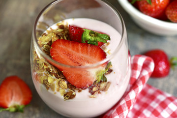 Strawberry yogurt with fresh berry and muesli.
