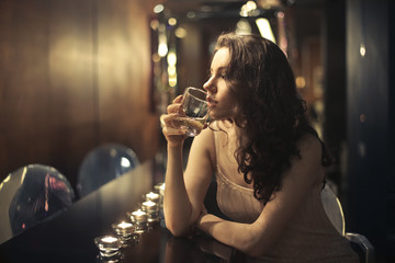 Young woman drinking a cocktail