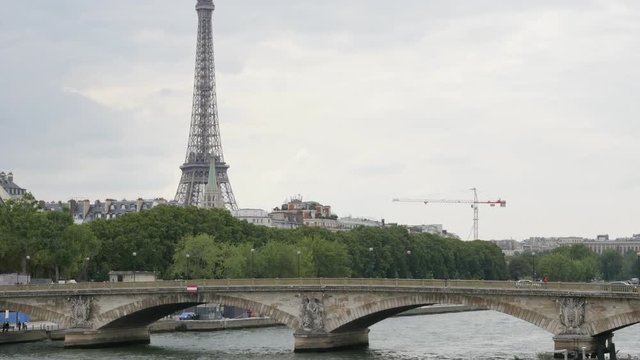 Bridges and Eiffel tower in the background slow tilting 4K 2160p 30fps UltraHD video - Bridges and river in French capital of Paris and Eiffel tower 4K 3840X2160 UHD footage 