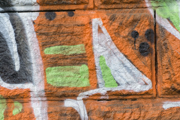 Detail of a graffiti art on a wall. Wall painted in different colors. Abstract background