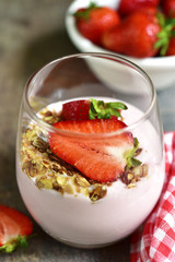 Strawberry yogurt with fresh berry and muesli.