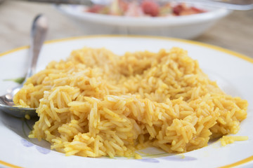 saffron rice with grated parmesan cheese