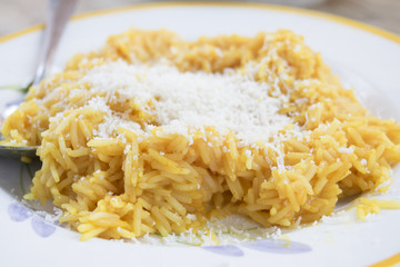 saffron rice with grated parmesan cheese