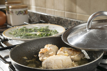 turkey roll stir fried in a saucepan