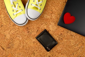 yellow sneakers on a background of cork