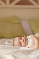 Fototapeta na wymiar baby girl on the bed
