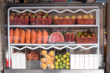 Showcase of cut fruit and juice stall in Tainan, Taiwan