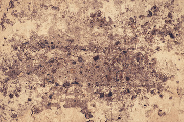 Dull concrete wall with peeling paint for use as background