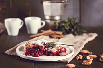 Cherry pie and a cup of coffee. Rustic style. Berry pie. Homemade cherry pie with flaky crust, cup of coffee, bowl with cherries